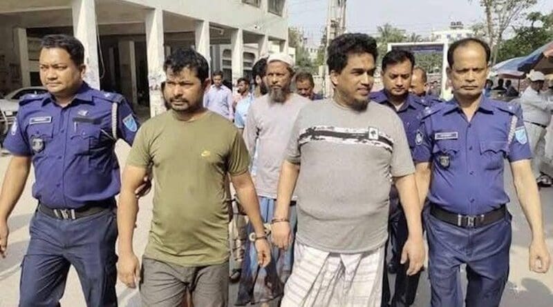 Members of the Bangladesh Rapid Action Battalion escort Arakan Rohingya Salvation Army leader Ataullah Abu Jununi (second from right) and alleged accomplices following their arrests near Dhaka, March 18, 2025. Photo Credit: Rapid Action Battalion