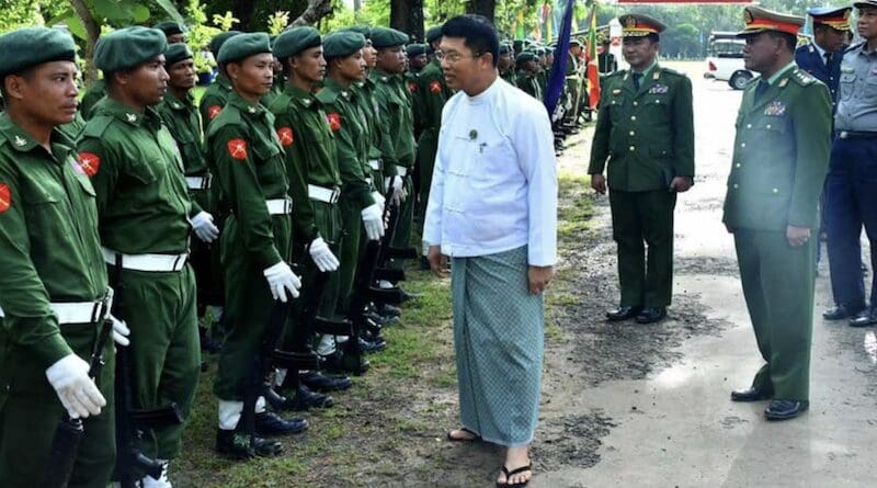 Myanmar junta Chief Minister of the Ayeyarwady Region Tin Maung Win, center, inspects new recruits in Pathein township, June 29, 2024. (RFA)