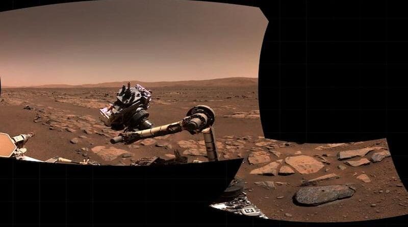 A mosaic of two pictures showing the rover arm after scanning and sampling one of the rocks discussed in the paper. The rock itself is in the lower right and clearly shows the hole where the sample was collected. The rock was given the informal name "Rochette" by the Perseverance science team. CREDIT: NASA/JPL-Caltech/ASU