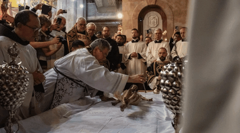The custos of the Holy Land, Father Francesco Patton, anoints the statue of Jesus on the Stone of Anointing during the ceremony known as the “funeral procession” on Good Friday night 2024. According to the tradition and the Status Quo, on the evening of Good Friday — both Catholic and Orthodox — the rite of preparing Jesus’ body for burial is reenacted on this stone during the so-called “funeral procession.” | Credit: Marinella Bandini, CNA