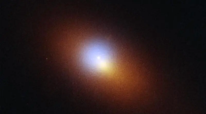 Long ago, in a galaxy 600 million light years from Earth, a star got too close to a massive black hole and was torn apart. This image combines observations of the tidal disruption event obtained in August 2024 by the Hubble Space Telescope and the Chandra X-Ray Observatory. The location, pinpointed by Hubble, is the bright blue-white dot of ultraviolet light in the middle of the blue X-ray haze detected by Chandra. The TDE is offset from the center of the galaxy, which appears as a bright orange-white blob at the center of the visible stars, colored orange. CREDIT NASA, ESA, STScI, Yuhan Yao (UC Berkeley); Image Processing by Joseph DePasquale (STScI)