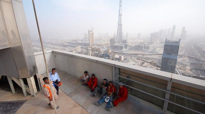 Dubai construction workers having their lunch break. Photo Credit: Piotr Zarobkiewicz, Wikimedia Commons