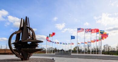 Flags flying in front of NATO headquarters. Photo Credit: NATO