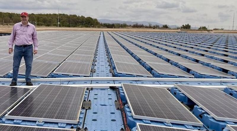 Mike Popp, Harold F. Ohlendorf Professor of agricultural economics and agribusiness for the University of Arkansas System Division of Agriculture and the Dale Bumpers College of Agricultural, Food and Life Sciences, stands on a floating solar array in Spain. CREDIT: Courtesy of Mike Popp