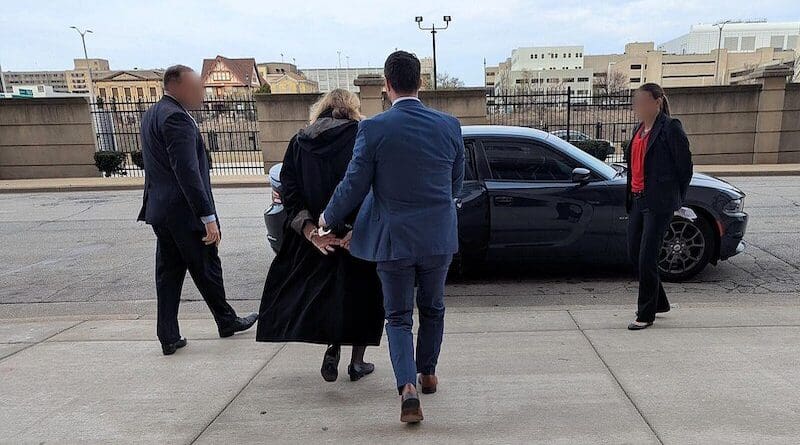 FBI agents arresting Wisconsin Circuit Court Judge Hannah Dugan. Photo Credit: FBI, Wikimedia Commons