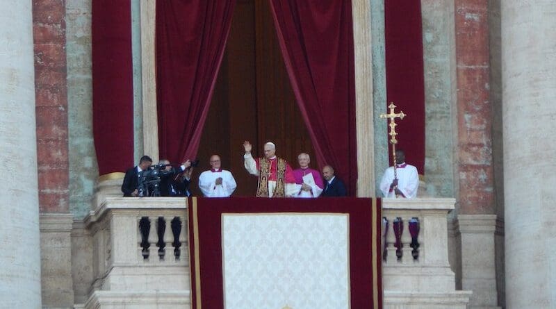 Pope Leo XIV waves at the people gathered in St. Peter's Square in his first public appearance as pope. Photo Credit: INFOWeather1, Wikipedia Commons