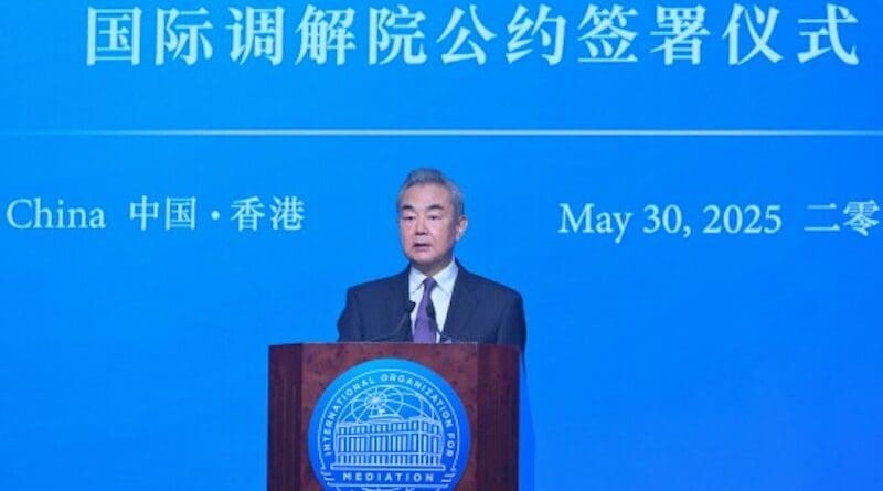 China's Foreign Minister Wang Yi, speaks at the Signing Ceremony of the Convention on the Establishment of the International Organization for Mediation and is the first to sign the Convention on behalf of China.