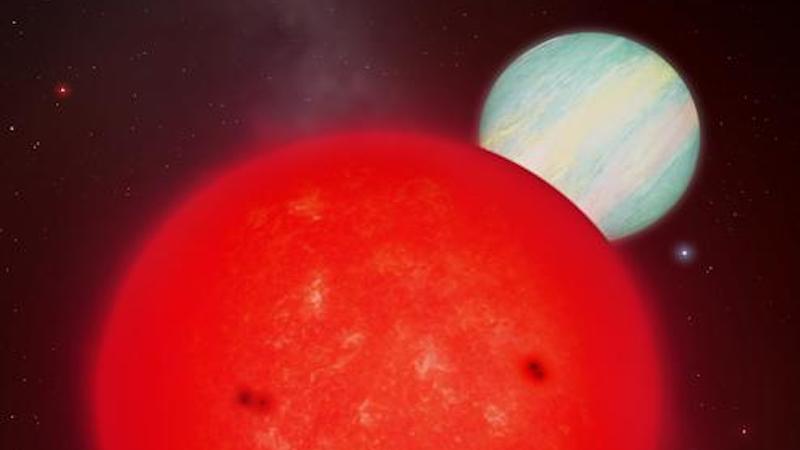 Giant Planet Orbiting a Tiny Star