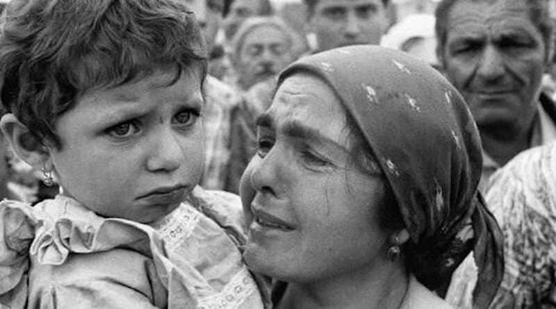 A deported Ahiska Turk woman and her child in exile in Uzbek SSR. Photo Credit: Fergana News, Wikipedia Commons