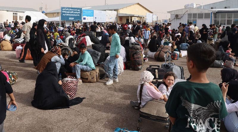 Afghans who have been deported from Iran gather at the Islam Qala border crossing in western Afghanistan. Photo Credit: UNHCR/Faramarz Barzin