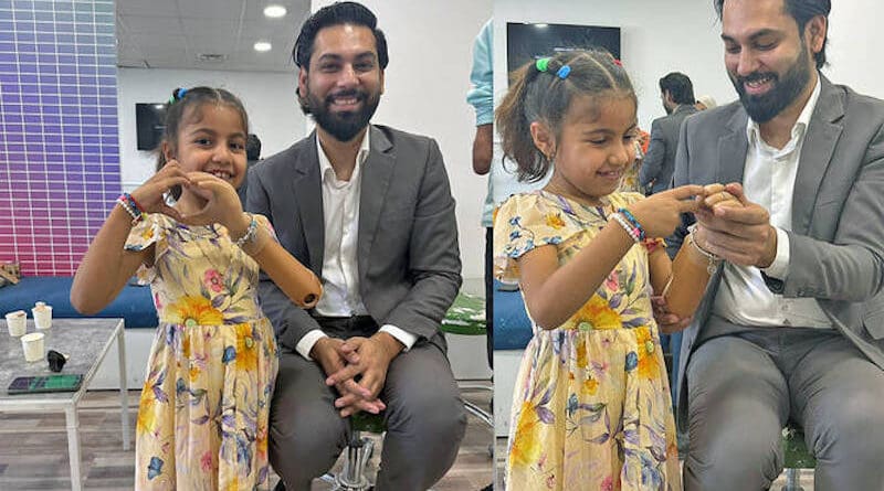 This combination of handout photos shows Anas Niaz, head of the Pakistani health-tech startup Bioniks, with Sidra, a young girl from Gaza, after a prosthetic limb fitting session in Amman, Jordan. (Handout/Bioniks)