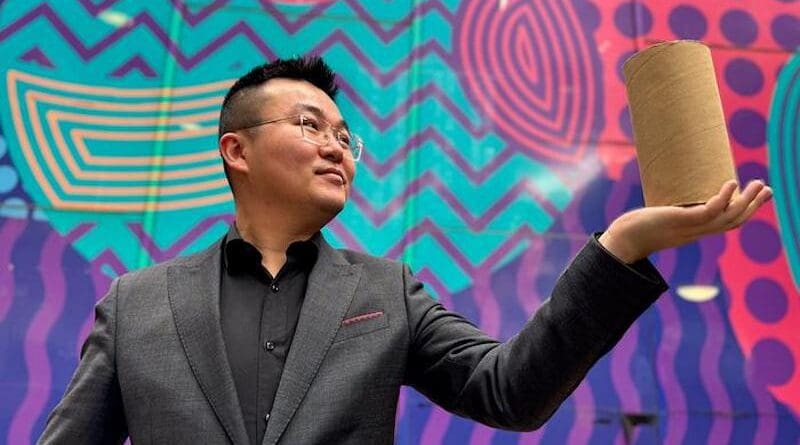 Image of study lead author Dr Jiaming Ma holding the cardboard-confined rammed earth material. CREDIT: RMIT University