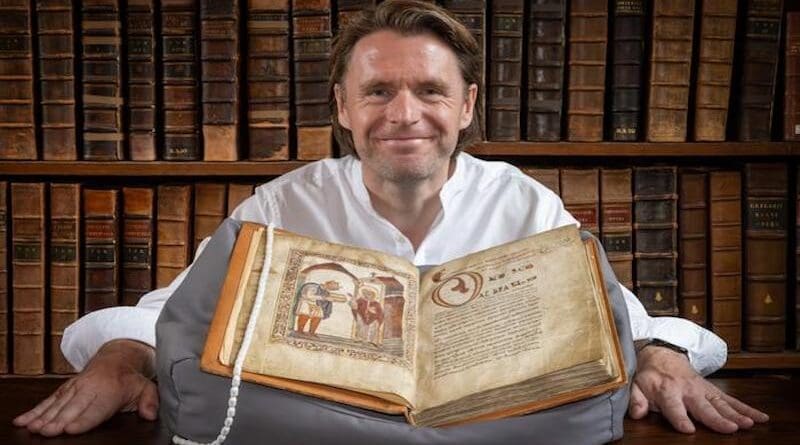 Professor David Woodman with the portrait of Æthelstan at the The Parker Library, Corpus Christi College, Cambridge CREDIT: The Parker Library, Corpus Christi College, Cambridge