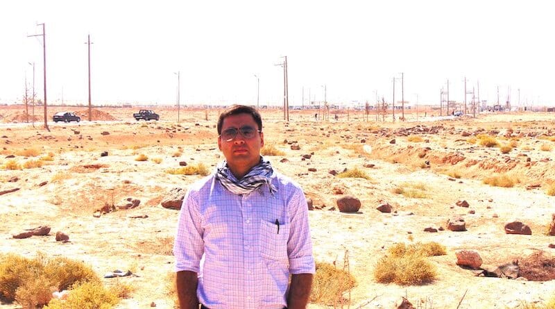 The author, Manish Rai, near a Syrian refugee camp.