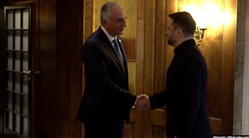 Ukrainian President Volodymyr Zelenskyy (right) shakes hands with Reza Pahlavi in Munich on February 13. Photo Credit: Screenshot from Zelenskyy video, via RFE/Rl