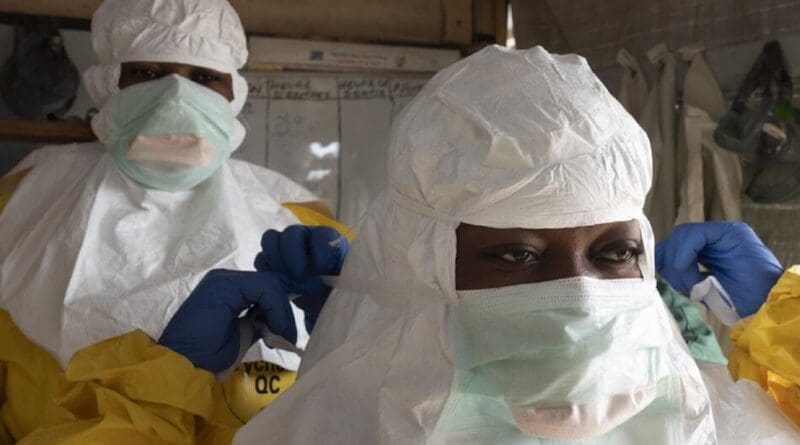 Health workers wearing protective clothing to prevent transmission. Photo Credit: WHO Africa
