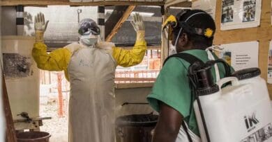 A health worker at an Ebola treatment centre in Beni, Democratic Republic of Congo (DRC), disinfecting a doctor after he had been contact with Ebola patients during an outbreak in 2019. A new outbreak in the DRC is raising international alarm. Copyright: Vincent Tremeau / World Bank (CC BY-NC-ND 2.0)