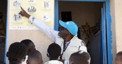 A UNICEF water and sanitation expert explains Ebola prevention measures to students at a primary school in Bunia, Ituri, DR Congo. Photo Credit: UNICEF/Carmel Ndomba Mbikayi