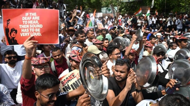 Cockroach janta party protestors holding posters of Bhagat Singh at Jantar Mantar with quote by Bhagat Singh: "If the deaf are to hear, the sound has to be very loud." July 2026. Photo Credit: Pelph Hoters, Wikipedia Commons
