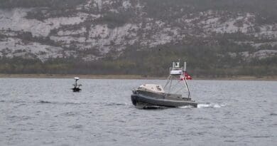 A Global Autonomous Reconnaissance Craft, right, and Lightfish USV operate in Norway’s Breivika Bay in May 2026. BRANDIE NUZZI/U.S. NAVY