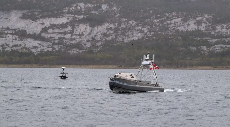 A Global Autonomous Reconnaissance Craft, right, and Lightfish USV operate in Norway’s Breivika Bay in May 2026. BRANDIE NUZZI/U.S. NAVY